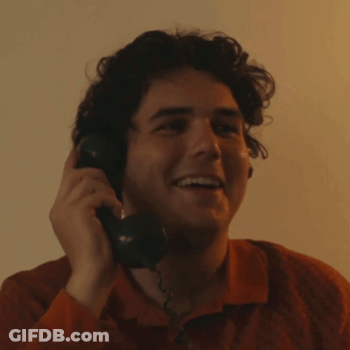 Young Man Smiling On Phone GIF