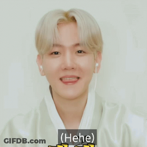 Young Man Smiling With Ear Buds Saying Hee GIF