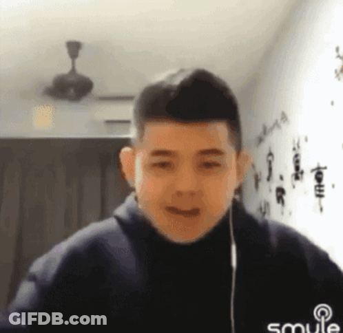 Young Man Smiling With Headphones GIF