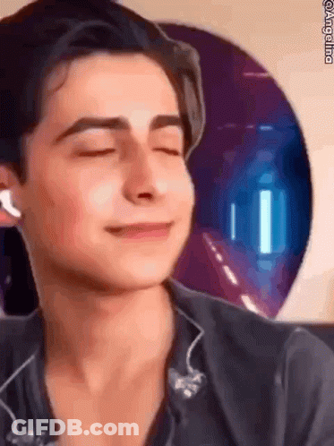 Young Man Smiling With Headphones GIF