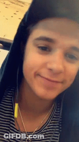 Young Man Smiling With Headphones GIF