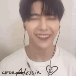 Young Man Smiling With Headphones GIF