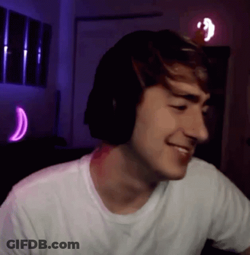 Young Man Smiling With Headphones GIF