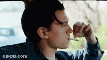 Young Man Smoking Cigarette In Car GIF