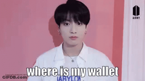 Young Man Standing In Front Of Pink Wall GIF