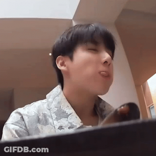 Young Man Sticking Tongue Out With Eyes Closed GIF