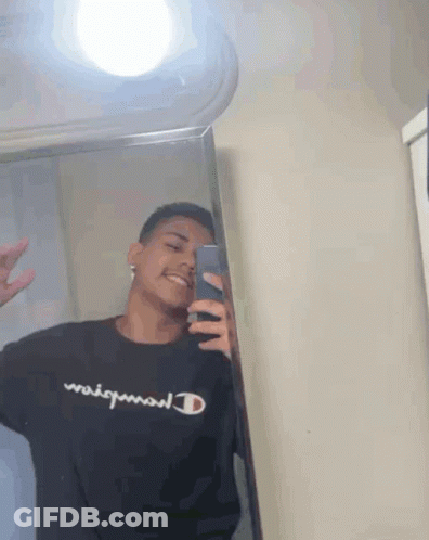 Young Man Taking Mirror Selfie In Black Champion Shirt GIF