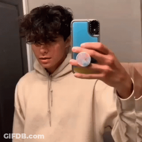Young Man Taking Mirror Selfie GIF