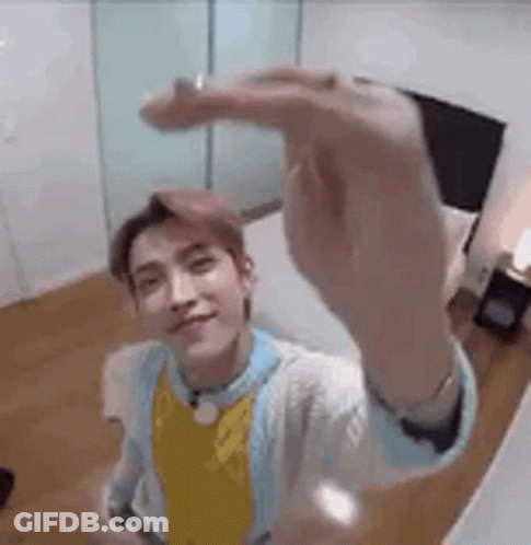 Young Man Taking Selfie In Bedroom GIF