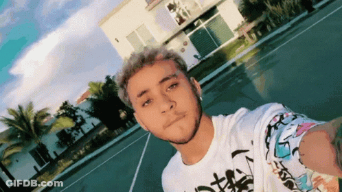 Young Man Taking Selfie In Front Of White House GIF