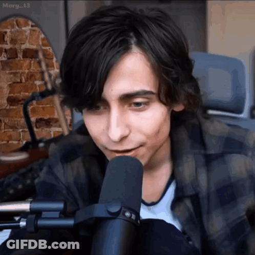 Young Man Talking Into Microphone GIF
