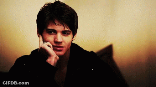 Young Man Talking On Cell Phone GIF