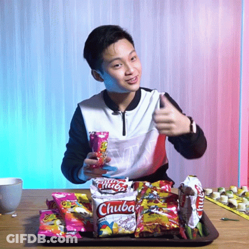 Young Man Thumbs Up Holding Chuba Snacks GIF