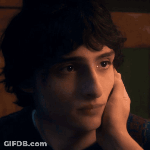 Young Man Touching Chin GIF