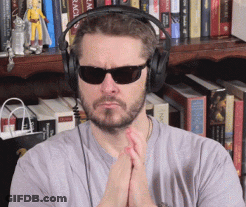 Young Man Waving Hands In Kitchen GIF