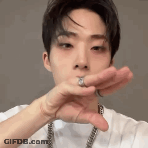 Young Man Wearing Black Sweater And O Necklace GIF