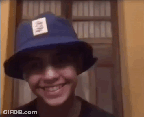 Young Man Wearing Blue Hat Smiling GIF