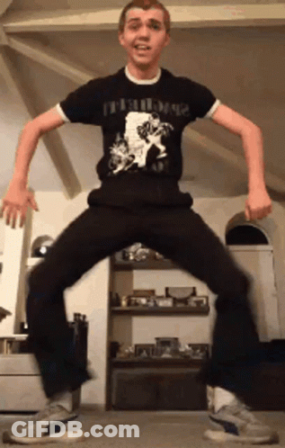 Young Man Wearing Damaged Man T-Shirt GIF