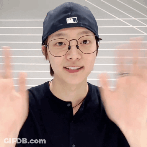Young Man Wearing Glasses And A Hat GIF
