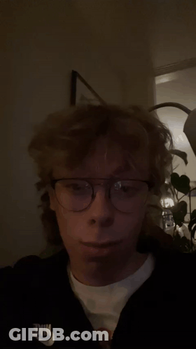 Young Man Wearing Glasses And Nike Sweatshirt GIF