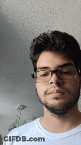 Young Man Wearing Glasses And White Shirt GIF