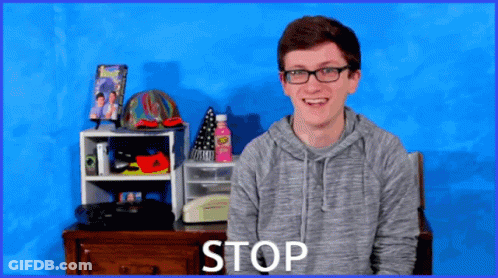 Young Man Wearing Glasses Saying Stop GIF