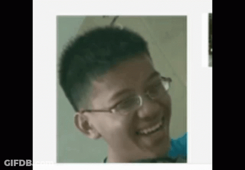 Young Man Wearing Glasses Smiling GIF