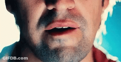 Young Man Wearing Green Bandana And Baseball Cap GIF