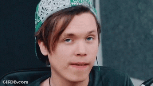 Young Man Wearing Green Bandana And Baseball Cap GIF