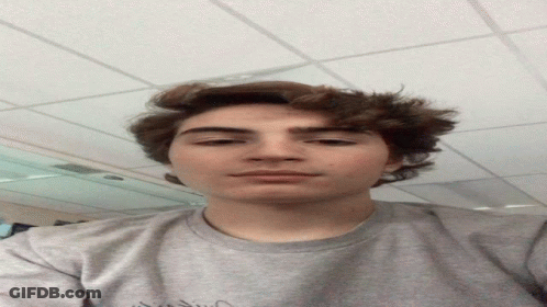 Young Man Wearing Grey Vision Shirt GIF