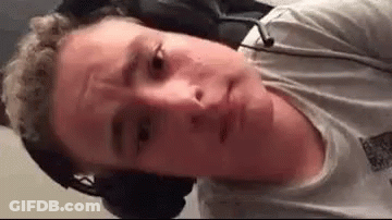 Young Man Wearing Headphones And Microphone Making Funny Face GIF