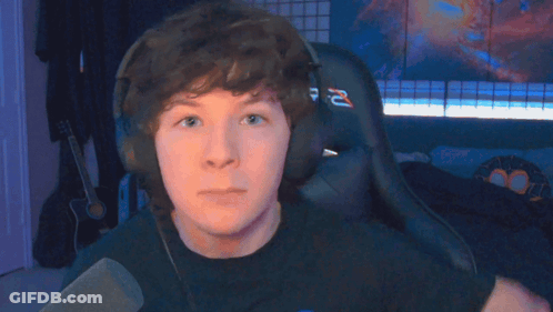 Young Man Wearing Headphones And R-Z Shirt GIF