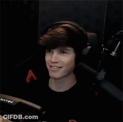Young Man Wearing Headphones And Smiling In Chair GIF