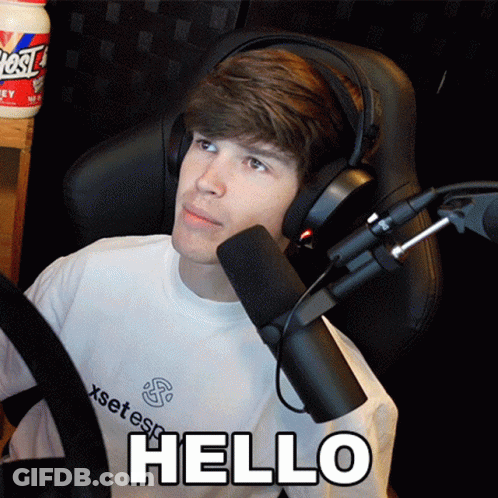 Young Man Wearing Headphones And White Shirt Says Hello GIF