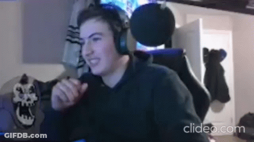 Young Man Wearing Headphones At Desk GIF