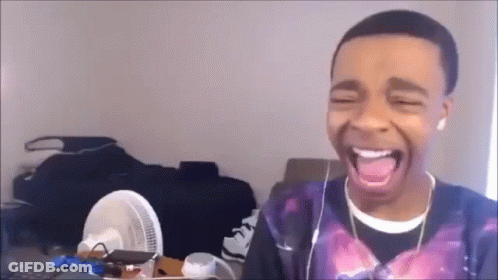 Young Man Wearing Headphones Laughing GIF