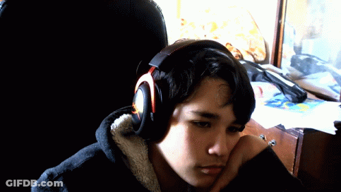 Young Man Wearing Headphones Looking Down GIF