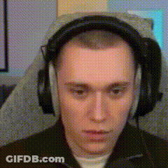Young Man Wearing Headphones Sitting In Chair GIF