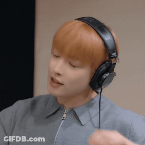 Young Man Wearing Headphones With L On Left GIF