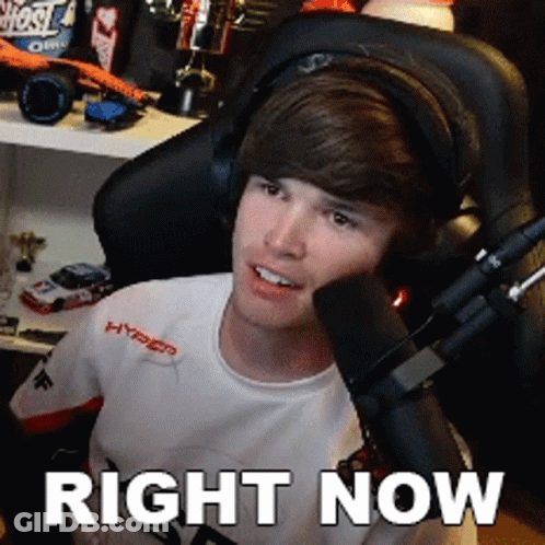 Young Man Wearing Headphones With Right Now Above Him GIF