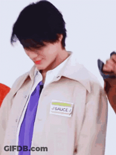 Young Man Wearing Jacket And Tie With Name Tag Sauce GIF