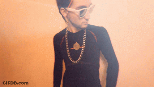 Young Man Wearing Sunglasses And Coin Necklace GIF