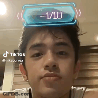 Young Man With 1/10 Sticker On Head GIF