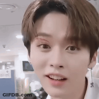 Young Man With Bandage On Eye And Earrings GIF