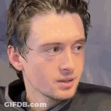 Young Man With Beard And Gray Shirt GIF