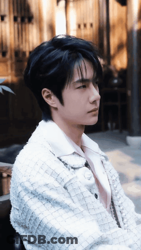 Young Man With Black Hair And White Jacket GIF