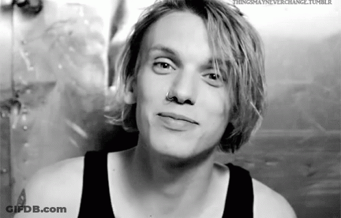 Young Man With Blonde Hair And Nose Ring In Black Tank Top GIF