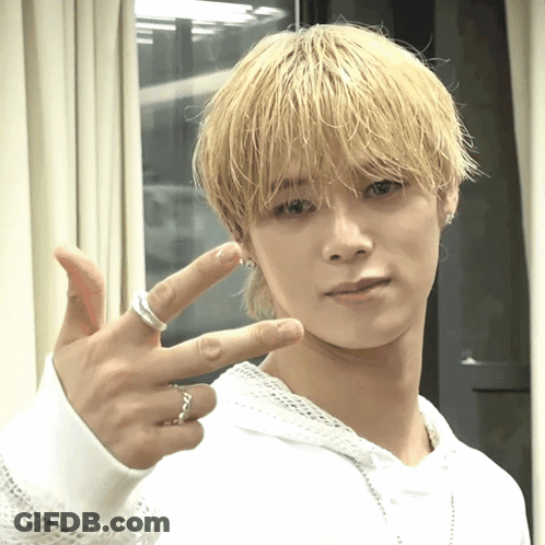 Young Man With Blonde Hair And Silver Ring GIF