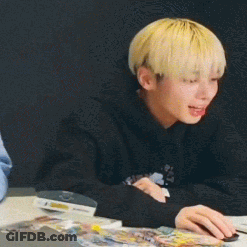 Young Man With Blonde Hair Holding Mouse GIF
