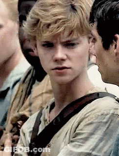 Young Man With Blonde Hair Making Funny Face In Crowd GIF